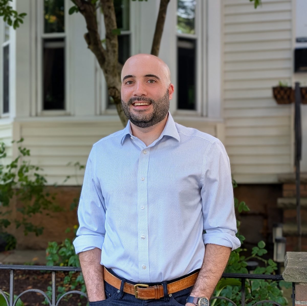 Dan Sheiner standing outside his home in Somerville